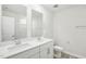 Bright bathroom with double sinks, a large mirror, and clean, modern fixtures at 3849 Rosebush Dr, Zebulon, NC 27597