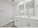 Bathroom featuring a double vanity, white cabinets and tile flooring at 3849 Rosebush Dr, Zebulon, NC 27597