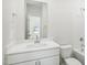 Bright bathroom featuring a single vanity, mirror, and shower/tub combo at 3849 Rosebush Dr, Zebulon, NC 27597