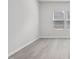 Neutral bedroom featuring light floors and two windows providing natural light at 3849 Rosebush Dr, Zebulon, NC 27597