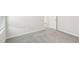 Bedroom with neutral carpet, white trim, and doors leading to other rooms at 3849 Rosebush Dr, Zebulon, NC 27597