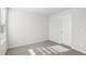 Neutral carpeted bedroom with a door, perfect for a functional and adaptable layout at 3849 Rosebush Dr, Zebulon, NC 27597