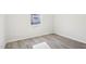 Neutral bedroom featuring hardwood floors and a window at 3849 Rosebush Dr, Zebulon, NC 27597