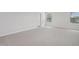 Bright bedroom with carpeted floors and three windows, providing plenty of natural light at 3849 Rosebush Dr, Zebulon, NC 27597