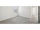 Bedroom with a window letting in natural light and neutral colored carpeting at 3849 Rosebush Dr, Zebulon, NC 27597