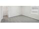 Cozy bedroom featuring neutral carpet, a window and a walk-in closet at 3849 Rosebush Dr, Zebulon, NC 27597