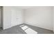 Bright bedroom featuring gray carpet, closet with double doors, and neutral walls for a cozy space at 3849 Rosebush Dr, Zebulon, NC 27597