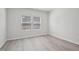 Bright bedroom featuring light floors and two windows providing natural light at 3849 Rosebush Dr, Zebulon, NC 27597
