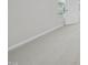 Carpeted bedroom featuring a window and a door at 3849 Rosebush Dr, Zebulon, NC 27597