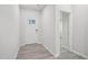 Inviting entryway featuring light gray floors, a white front door, and entry to another room at 3849 Rosebush Dr, Zebulon, NC 27597
