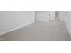 Hallway with neutral colored carpet at 3849 Rosebush Dr, Zebulon, NC 27597