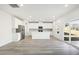 Bright, open kitchen featuring white cabinets, stainless steel appliances, and a center island at 3849 Rosebush Dr, Zebulon, NC 27597