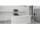Modern kitchen featuring stainless steel appliances, a center island and bright white cabinets at 3849 Rosebush Dr, Zebulon, NC 27597