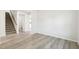 Spacious living room with light gray plank flooring and natural lighting at 3849 Rosebush Dr, Zebulon, NC 27597