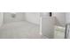 Spacious loft area with neutral carpet and bright windows at 3849 Rosebush Dr, Zebulon, NC 27597