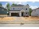 Two-story home with attached two-car garage in the process of being built at 3857 Rosebush Dr, Zebulon, NC 27597
