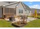 Inviting backyard with patio, outdoor seating, and beautifully landscaped garden at 45 Melody Dr, Youngsville, NC 27596