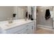 Modern bathroom with double vanity, quartz countertop, and glass-enclosed shower at 45 Melody Dr, Youngsville, NC 27596