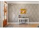 Elegant foyer featuring hardwood floors, decorative wall trim, and a stylish console table at 45 Melody Dr, Youngsville, NC 27596