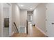 Hallway with hardwood floors, natural light and access to other rooms in the house at 45 Melody Dr, Youngsville, NC 27596