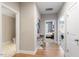 Inviting hallway with hardwood floors and access to various rooms at 45 Melody Dr, Youngsville, NC 27596