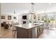 Open concept kitchen featuring a large island with sink, open to living room and dining area with hardwood floors at 45 Melody Dr, Youngsville, NC 27596