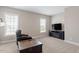 Comfortable living room featuring plush seating, a modern fireplace, and natural light at 45 Melody Dr, Youngsville, NC 27596