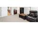 Cozy living room with plush armchair, side table and black mini fridge at 45 Melody Dr, Youngsville, NC 27596