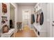 Mudroom featuring a built in bench, coat hooks, and access to a powder room at 45 Melody Dr, Youngsville, NC 27596