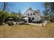 An outdoor living space with patio, seating, landscaping, and a well-maintained yard in a peaceful setting at 5004 Lakemont Dr, Raleigh, NC 27609