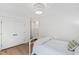 Charming bedroom showcases light walls, wood floors, a double door closet, and soft natural light at 5004 Lakemont Dr, Raleigh, NC 27609