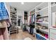 Walk-in closet featuring custom shelving, ample storage space, and organized areas for accessories at 5004 Lakemont Dr, Raleigh, NC 27609