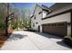 A long driveway leads to a two-car garage with basketball hoop and gated entrance at 5004 Lakemont Dr, Raleigh, NC 27609