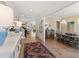 Beautiful foyer featuring a stylish sideboard, lamps, rug, staircase and open dining room at 5004 Lakemont Dr, Raleigh, NC 27609