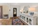 Beautiful foyer featuring a stylish sideboard, lamps, rug and a glimpse of other rooms at 5004 Lakemont Dr, Raleigh, NC 27609