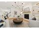 Cozy living room with a white brick fireplace, stylish decor, and comfortable seating arrangement at 5004 Lakemont Dr, Raleigh, NC 27609