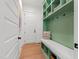 Inviting mudroom with custom built-ins, seating, and ample storage space for organized living at 5004 Lakemont Dr, Raleigh, NC 27609