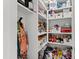 Walk-in pantry with open shelving and plentiful storage for food, drinks, and appliances at 5004 Lakemont Dr, Raleigh, NC 27609