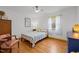 Sunny bedroom with hardwood floors, natural light, and tasteful decor at 5130 Guess Rd, Durham, NC 27712