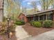 Beautiful brick home with professional landscaping and a curved walkway to the front door at 5130 Guess Rd, Durham, NC 27712