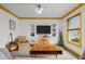 Comfortable living room with neutral carpet, large window, guitar, and plenty of room to relax at 5130 Guess Rd, Durham, NC 27712