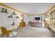 Spacious living room featuring white walls, carpeted floors, and lots of natural light at 5130 Guess Rd, Durham, NC 27712