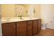 Bathroom featuring a double sink vanity with dark wood cabinets and modern fixtures at 536 Dearing Dr, Haw River, NC 27258