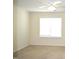 Bright bedroom featuring a ceiling fan and a large window letting in plenty of natural light at 536 Dearing Dr, Haw River, NC 27258