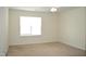 Bright bedroom featuring a ceiling fan and a large window letting in plenty of natural light at 536 Dearing Dr, Haw River, NC 27258