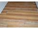 Close-up of new hardwood flooring, showcasing its texture and color, adding warmth and value to the home at 536 Dearing Dr, Haw River, NC 27258