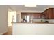 Bright kitchen with stainless steel appliances, breakfast bar, and view to the hall at 536 Dearing Dr, Haw River, NC 27258