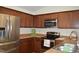 Kitchen with stainless steel appliances, wood cabinets and laminate countertops at 536 Dearing Dr, Haw River, NC 27258