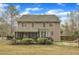 Expansive backyard featuring a screened porch, mature landscaping and a private setting at 5521 Erinvale Ct, Holly Springs, NC 27540