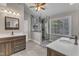 Bathroom featuring dual vanities, walk-in shower, and modern fixtures at 5521 Erinvale Ct, Holly Springs, NC 27540